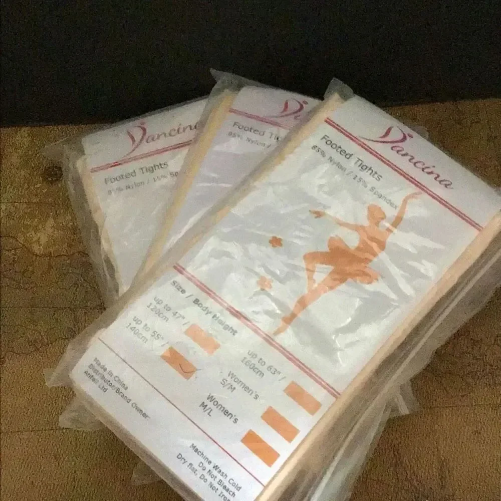 Footed tights by Dancina Three packs two pair each Please look at the size I don